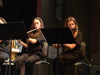 Two female students playing flutes