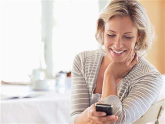 woman looking at smartphone