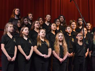 Bidwell choir students in black singing