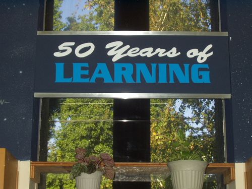 Sign in library reading 50 years of learning