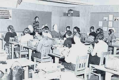 Black and white photo of students in classroom circa 1960